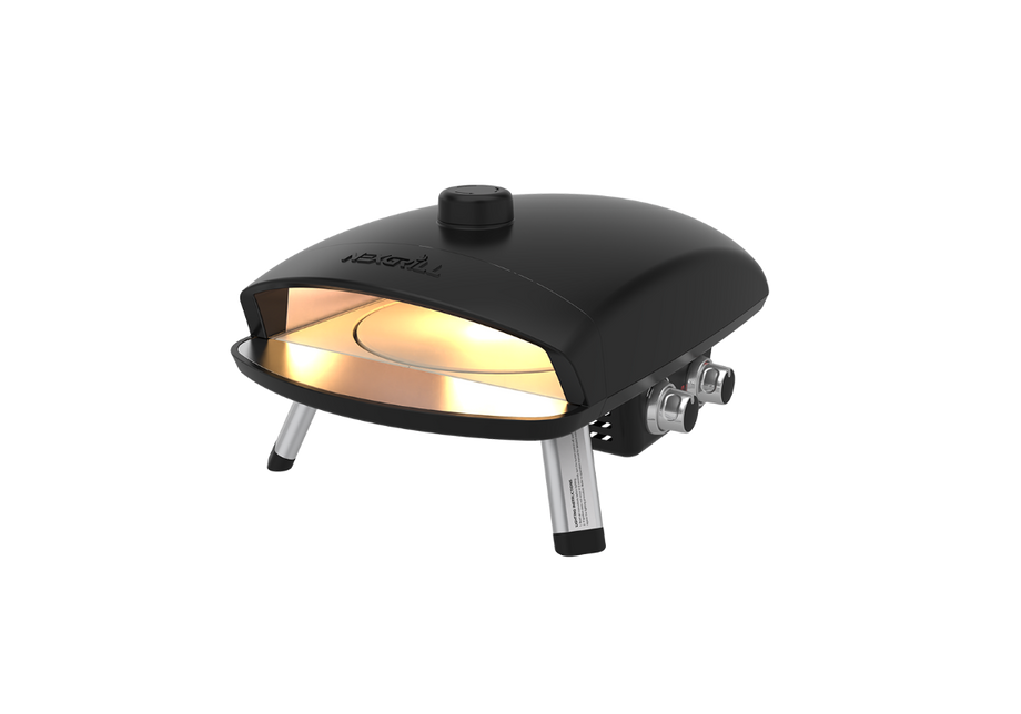 The Nexgrill Ora 12 Propane Gas Pizza Oven features a sleek black tabletop design with sturdy metallic legs and a front opening that reveals its illuminated interior and a round pizza stone inside, all set against a plain white background.
